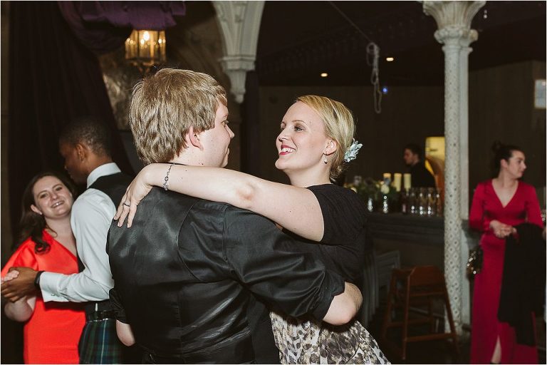 guests-smiling-at-each-other-while-they-dance