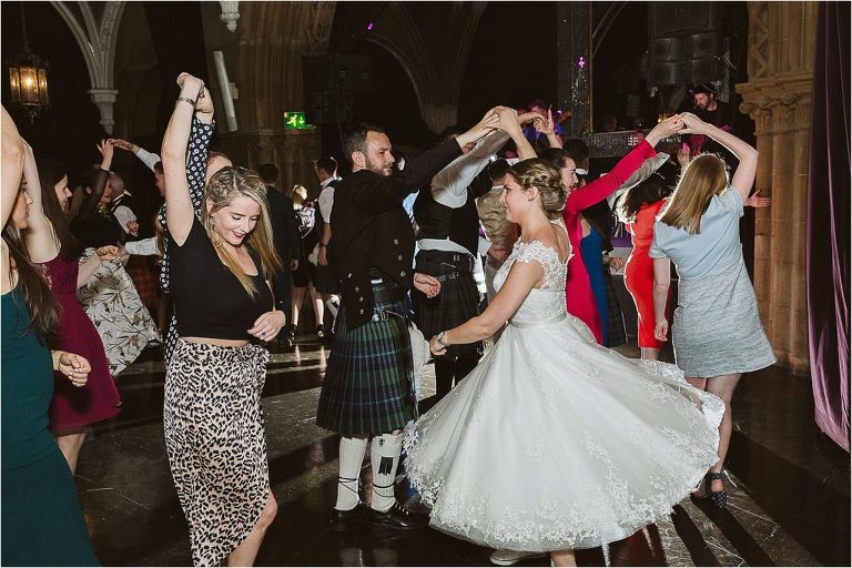 groom-spins-bride-during-scottish-ceilidh-dancing