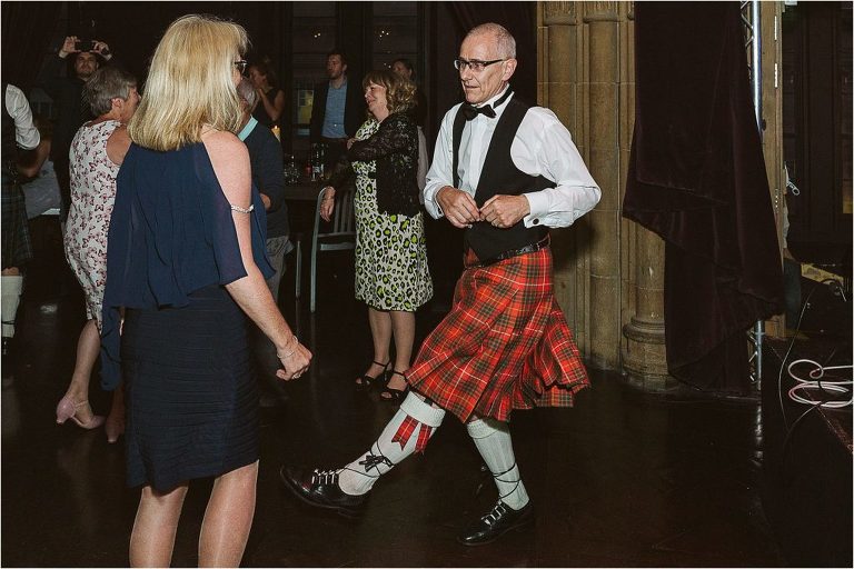 weding-guest-kicks-out-leg-dduring-ceilidh-dance