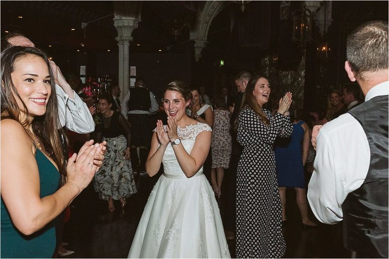 bride-clapping-hands-as-song-finishes