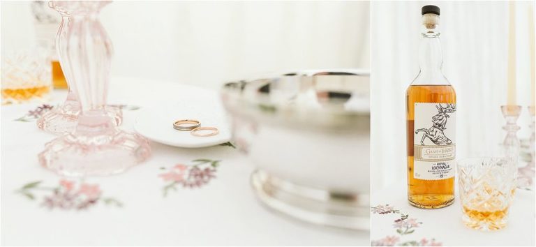 rose-gold-wedding-rings-and-game-of-thrones-whisky-in-crystal-glasses
