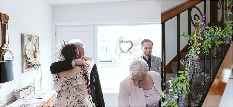 guests-hugging-and-garland-of-fake-flowers-on-staircase