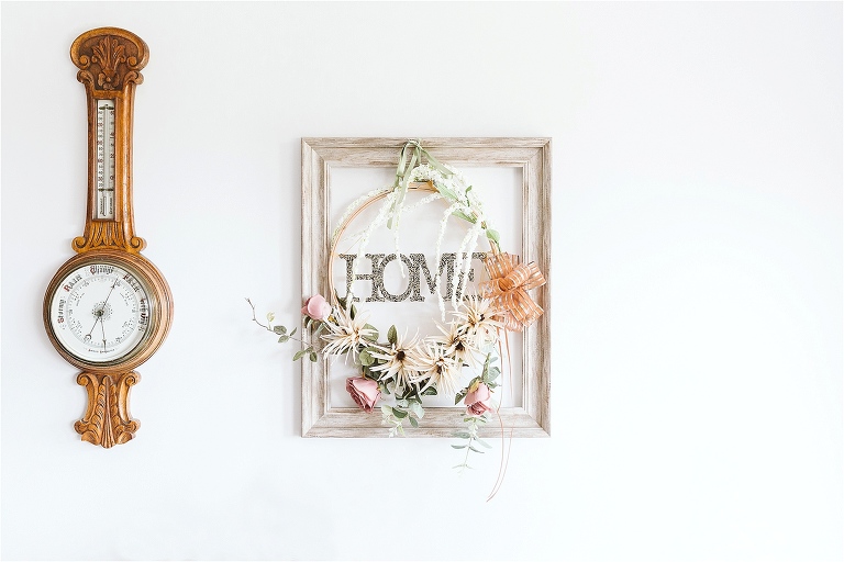 home-sign-with-ring-of-faux-flowers
