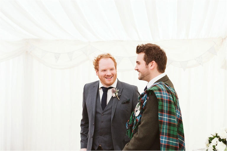 best-man-laughing-with-groom-before-wedding-starts