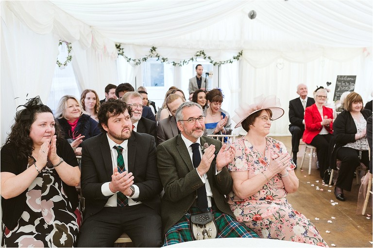 guests-clapping-during-ceremony