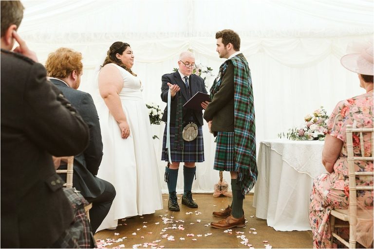 bride-and-groom-look-at-each-other-after-handfasting