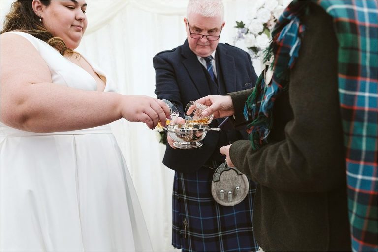 bride-and-groom-pour-whisky-in-to-quaich