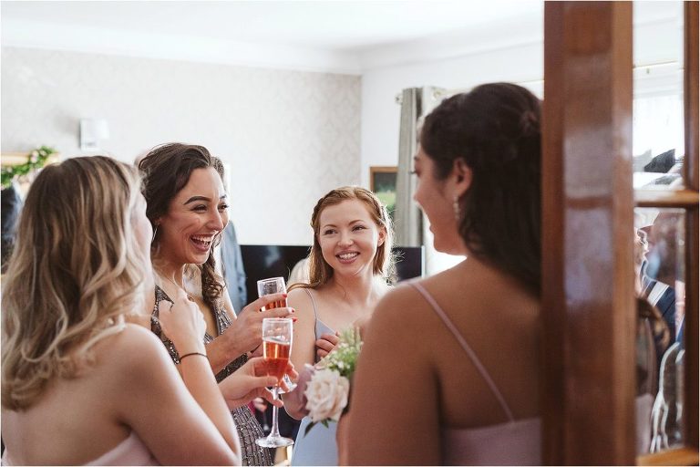 bridesmaid-laughing-with-other-guests