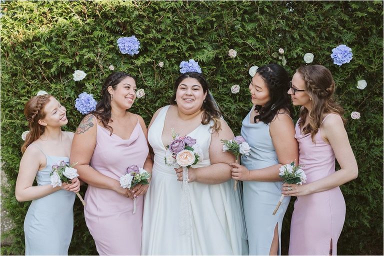 bride-and-bridesmaids-wearing-pastel-pink-and-blue