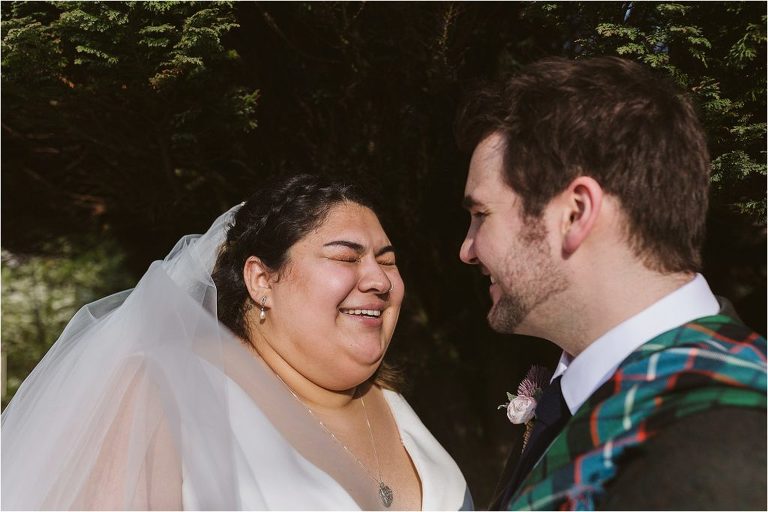 bride-and-groom-laugh-together