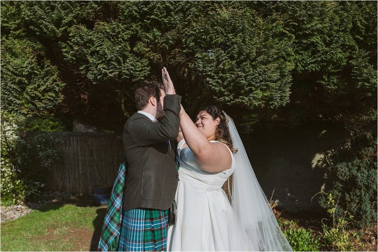 bride-and-groom-high-five-each-other