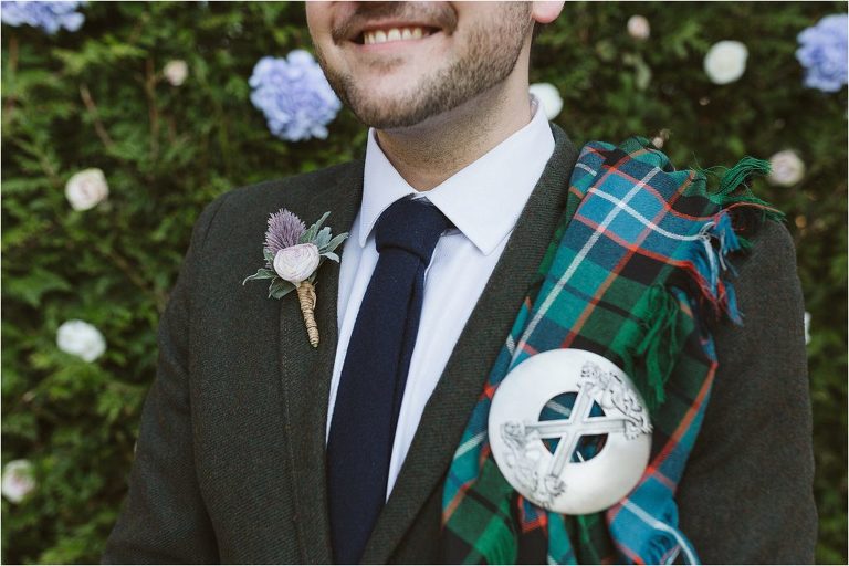 close-up-of-grooms-navy-blue-tie