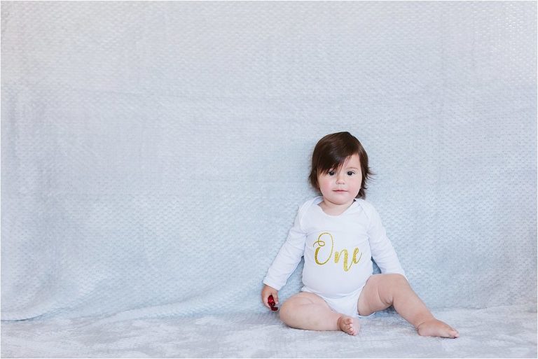 little-girl-sitting-on-floor