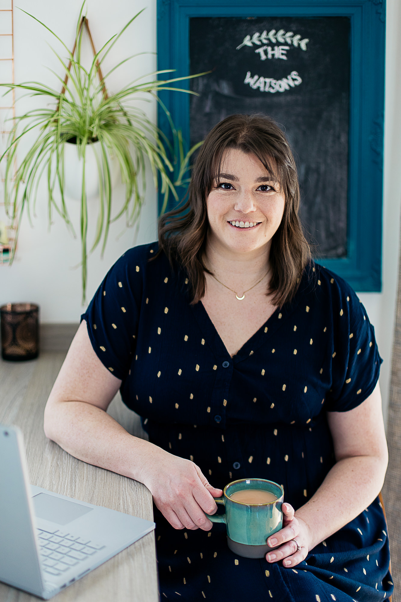 woman-drinking-tea-working-at-laptop