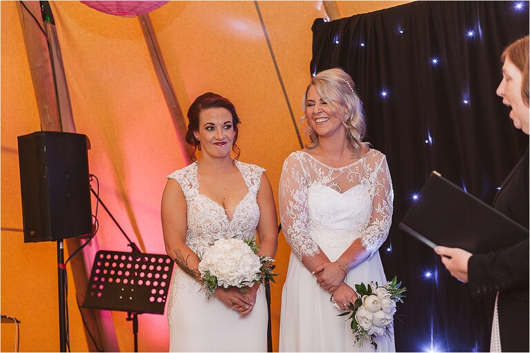 brides-laughing-during-wedding-ceremony