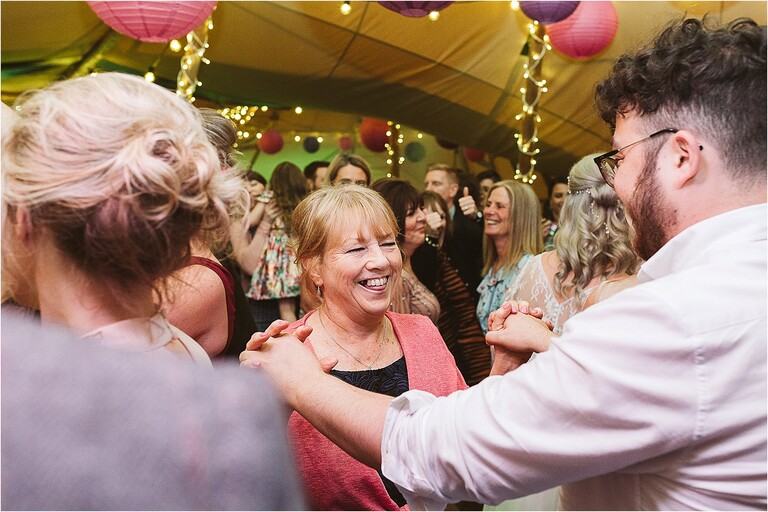 mother-of-bride-smiling-and-dancing-with-guest