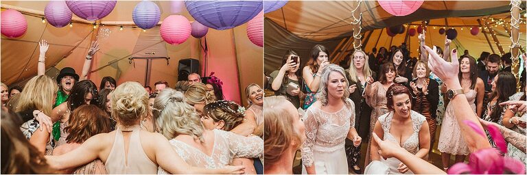 guests-dancing-around-two-brides-at-wedding-reception