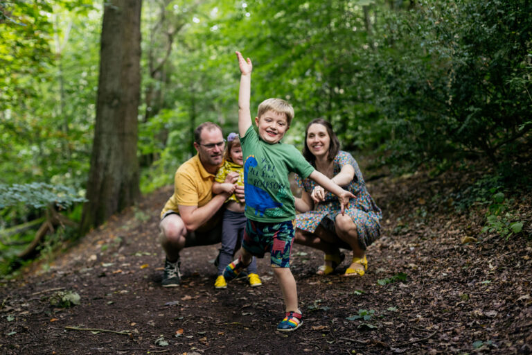 boy-jumps-for-joy-and-has-right-hand-in-air-as-he-runs-towards-the-camera