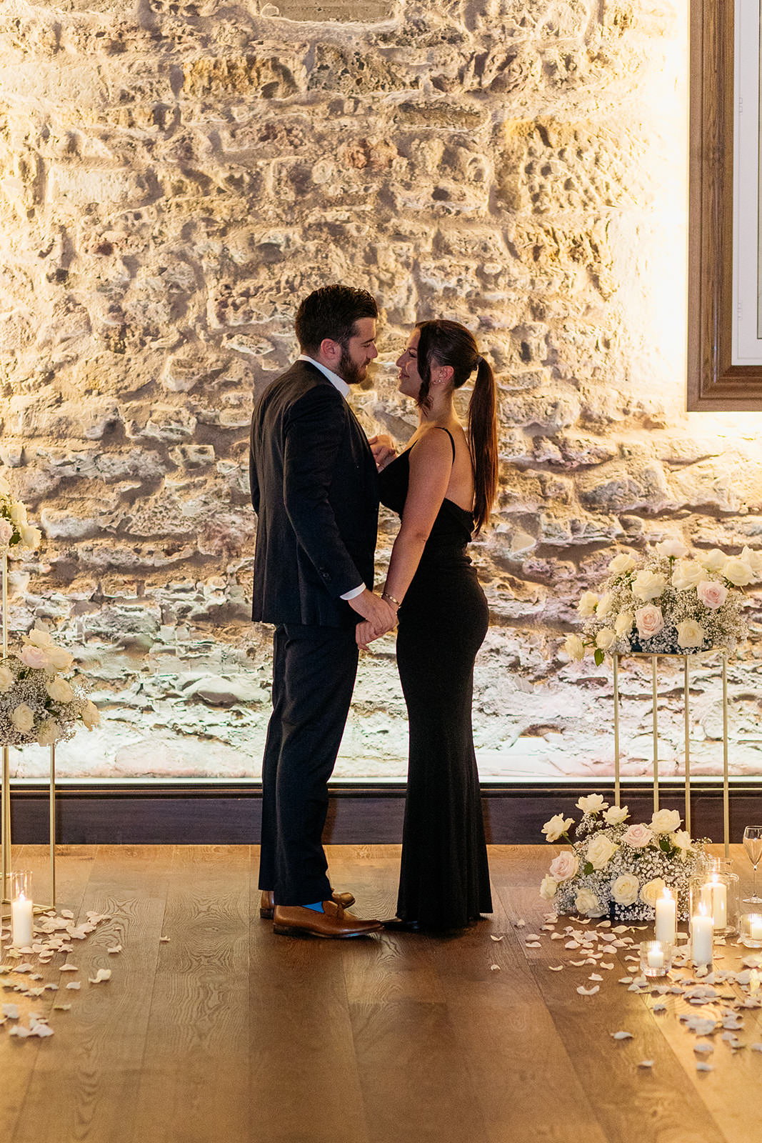 moment-captures-man-proposing-to-his-girlfriend-they-are-facing-each-other-and-smiling