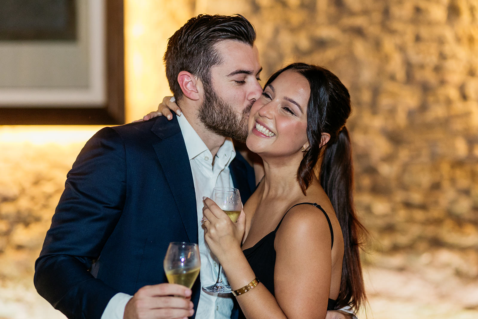 man-kissing-his-new-fiancee-on-the-cheek