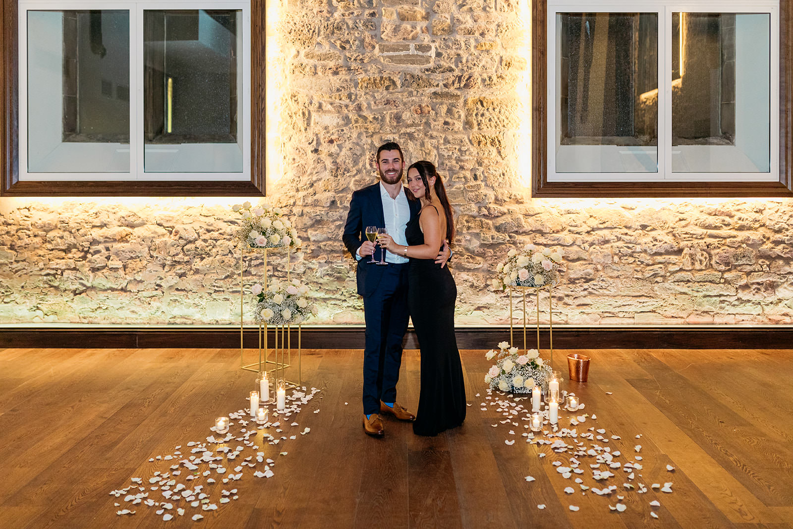 couple-embrace-just-after-proposal-the-couple-are-happy-and-clinking-their-champagne-glasses